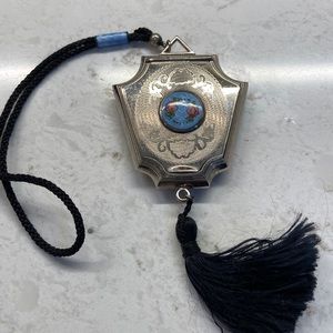 Guilloche ladies hand compact with face powder.